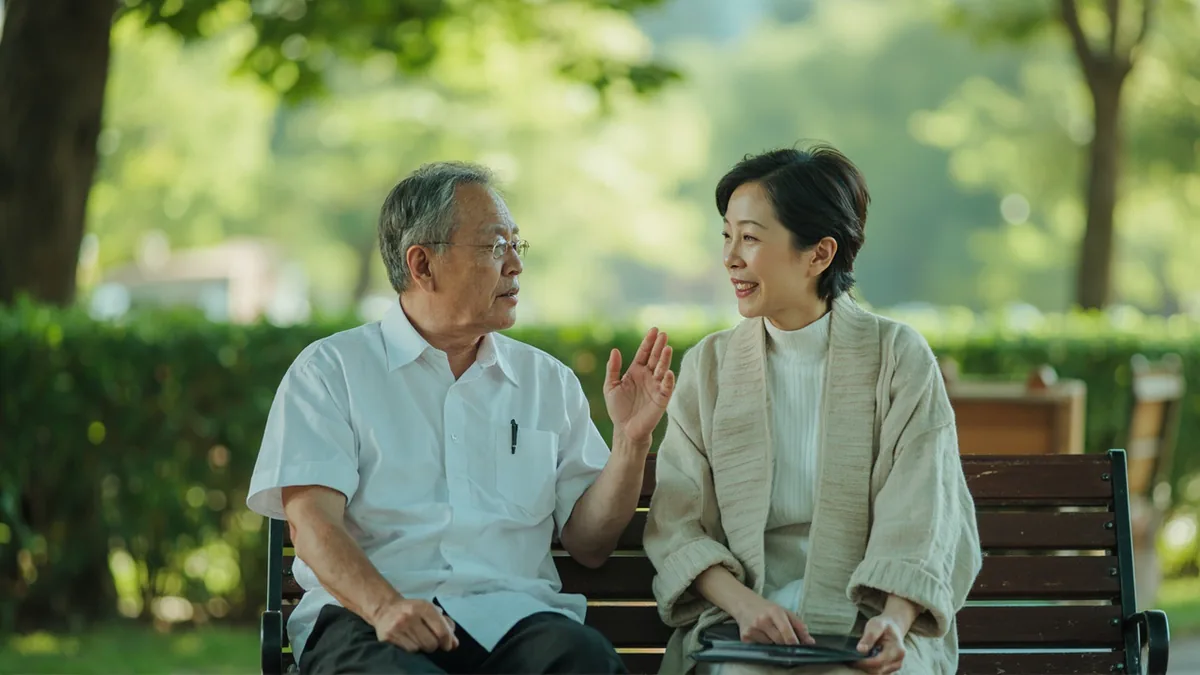 A person listens with empathy and offers comfort to a friend in a park, illustrating “practicing empathy” in Chinese: 将心比心 (jiāng xīn bǐ xīn)