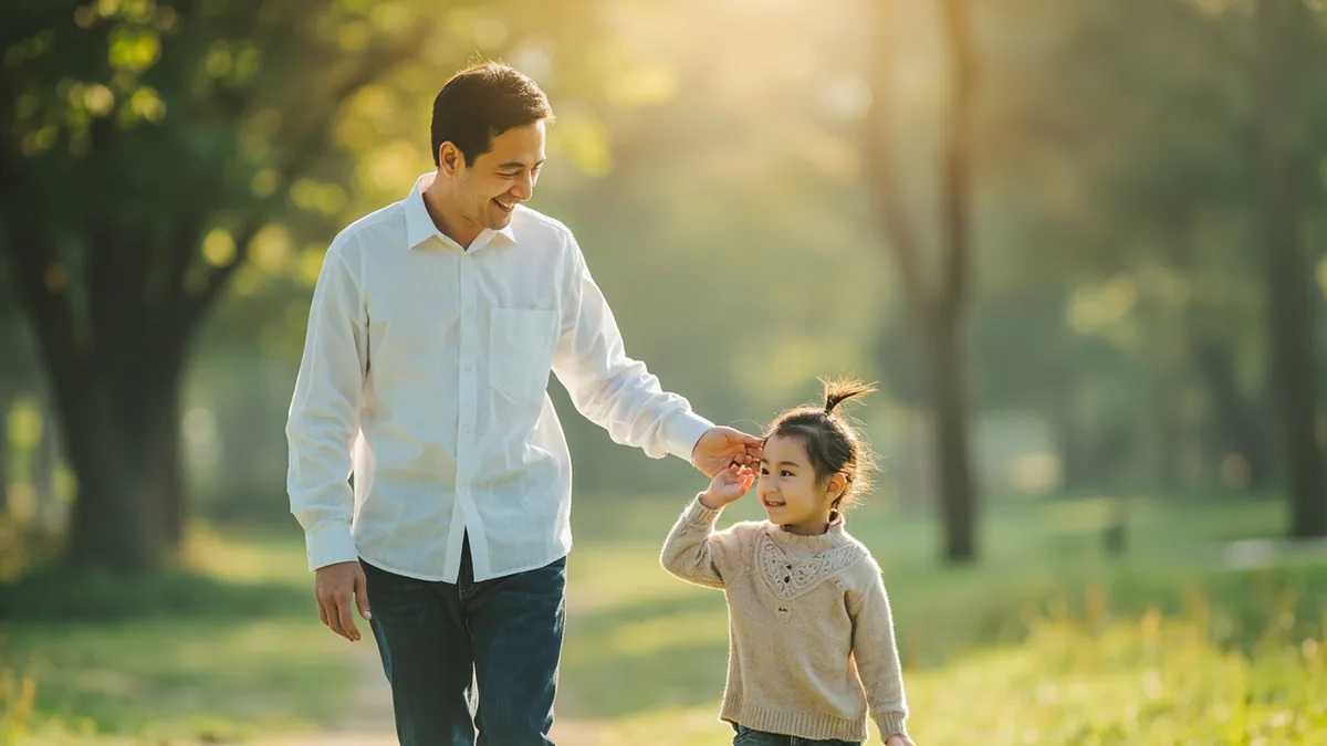 A father and child share a warm, affectionate moment together, illustrating “dad” in Chinese: 爸爸 (bàba)